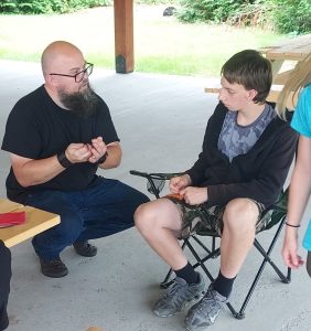 youth and volunteer working on crafts