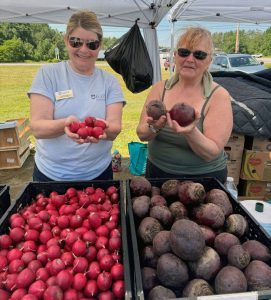 horticulture participants holding root vegetables