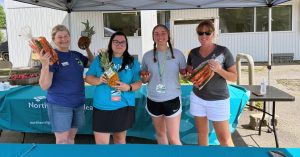 horticulture participants holding fruits and vegetables