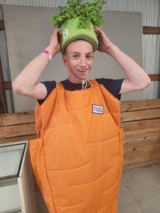 John dressed in a carrot suit