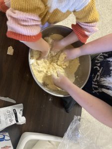 Youth kneading the dough by hand
