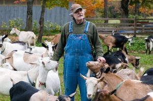 Goat producer with goats; photo by Edwin Remsberg