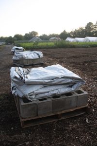 tarp kits set beside the field