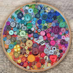 Colorful buttons sewn onto an embroidery hoop
