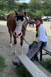 4-H youth and her horse wearing Toy Story costumes