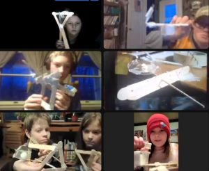 Seven youth showing their catapult creations over Zoom