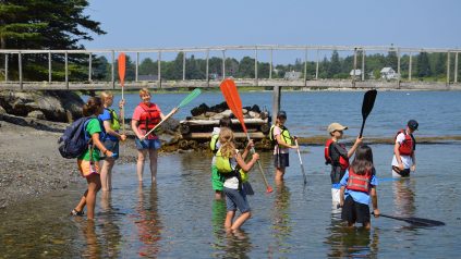 campers participate in paddling school