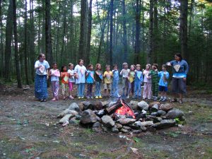 campers participate in day camp campfire skit