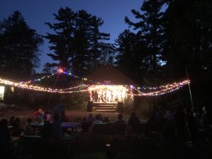 Tanglewood dining hall lit up at night during Tanglewoodstock