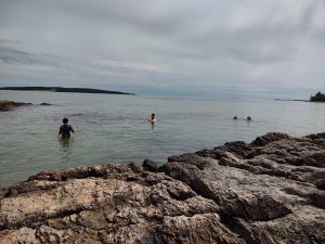 Kids swimming in the ocean at Drift Inn Beach