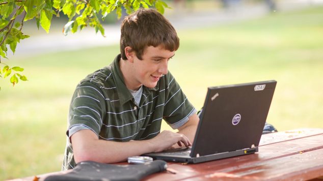 young man using a laptop