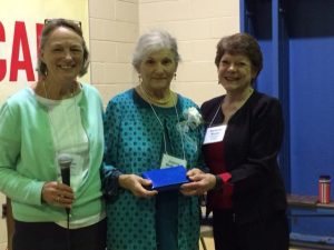 Wendy Harrington (l) and Marianne Moore (r) of the Washington County Extension Association present Joanne McMahon (c) with a University of Maine Volunteer Pen Award.
