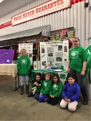 North Wood 4-H Club group participates in the Paper Clover Campaign at Tractor Supply Company.