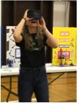 Inez, a 4-H Tech Changemaker team member took some time out from collecting survey data at the Fort O'Brien School Family STEM Night to check out the "Google Goggles".