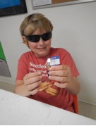 Participant of 4-H Summer of Science, Will it Light? activity.