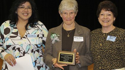 Washington County Extension Association (WCEA) Board Member Lynn Mitchell , left, and WCEA President Marianne Moore present the Leon Look Distinguished Volunteer Award to Marilyn Ness of Lubec, center, for her volunteer efforts with the Univeristy of Maine Cooperative Extension.