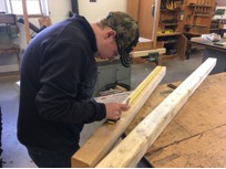 student working with wood