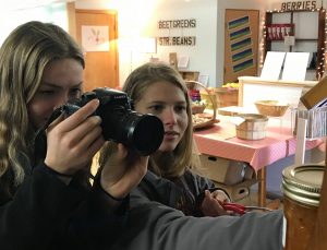4-H members take video using a camera.