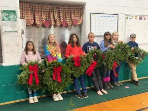 youth displaying their wreath creations