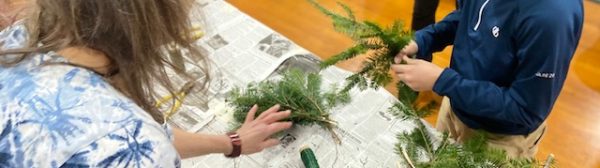 youth making a wreath