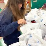 youth fills goodie bags