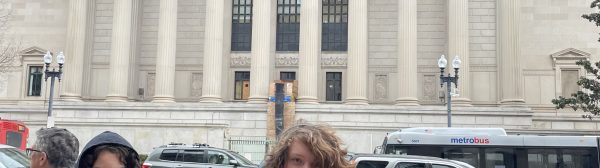 Oh Yea youth stand beside the National Archives Building in Washington D.C.