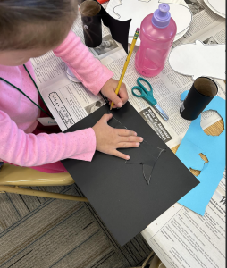 Youth working on crafts at the club meeting.