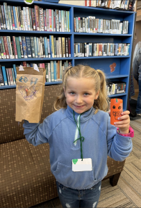 Youth showing off crafts made at the club. 