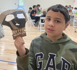 4-H'er with a mask he created. 