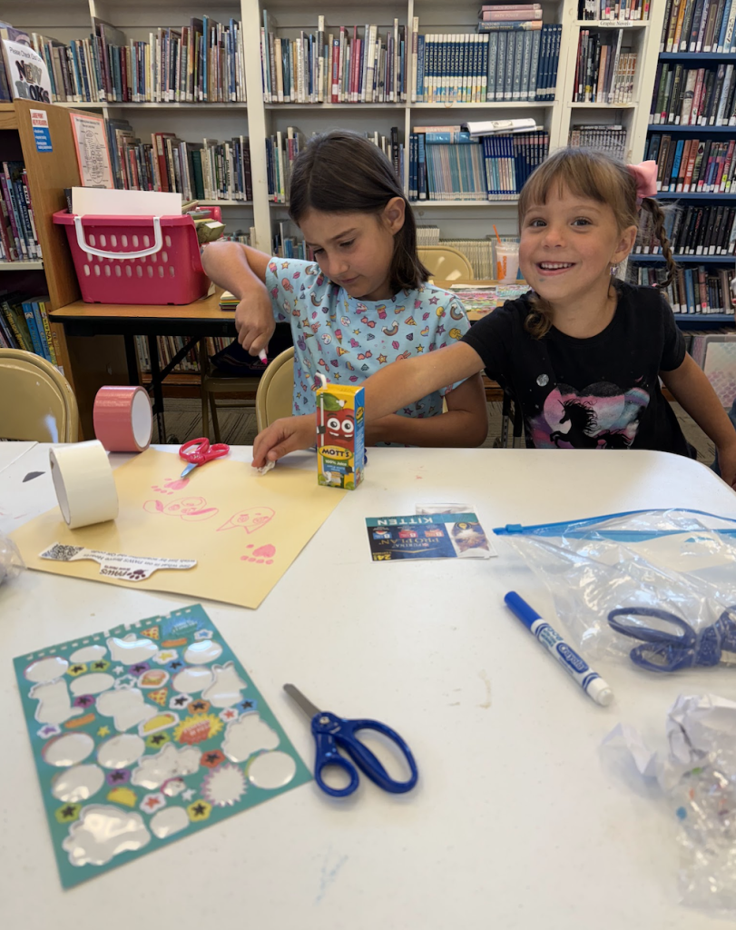 Youth work on creating a donation box. 