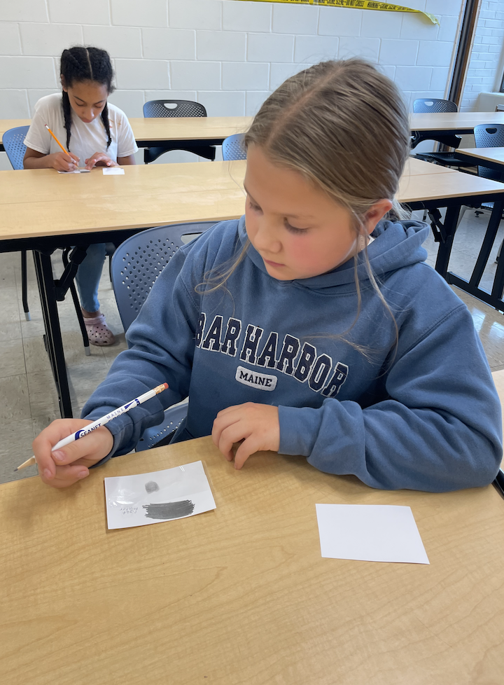 youth works on finger printing activity 