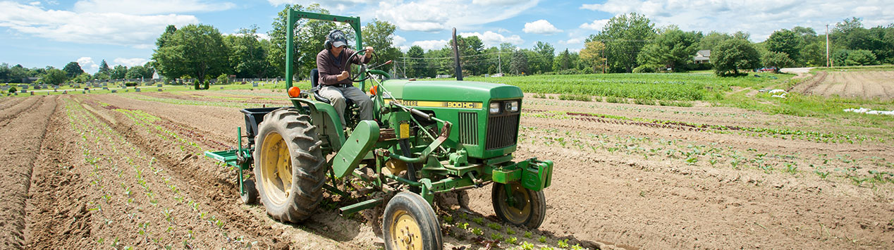 farmer on tractor plowing feild