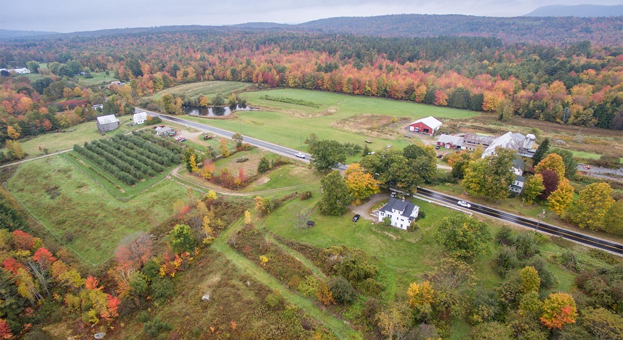 aerial view of a farm and gardens in autumn