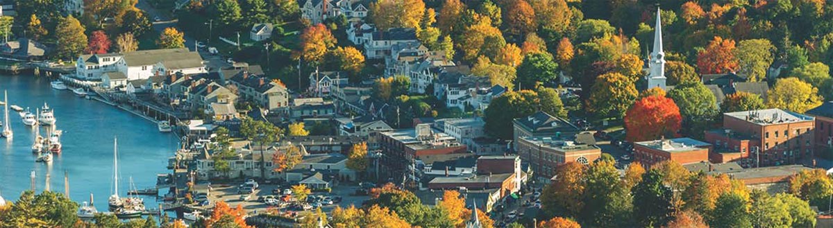 header image for Sustainable Communities section of the annual report, an aerial scenic view of Camden harbor