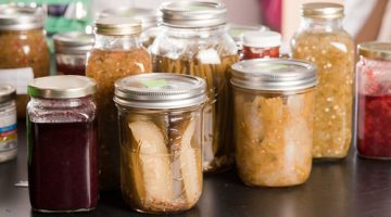 various types of canned foods in jars