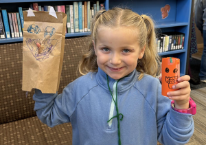 youth with paper bag crafts