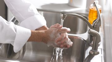 person washing their hands