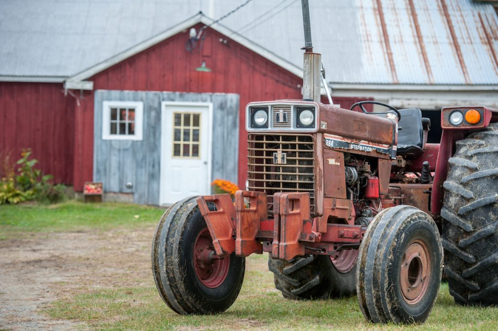 tractor in front of barn
