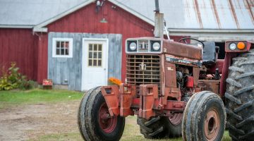 tractor in front of barn