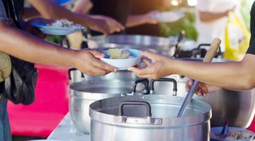 Scoop buffet food at a restaurant catering food