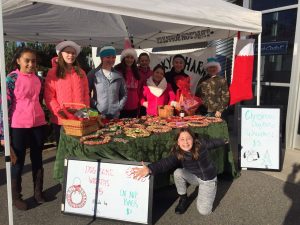 Lucky Clover 4-H Club selling dog bone wreathes at a fundraiser at Tractor Supply, Inc. before Christmas
