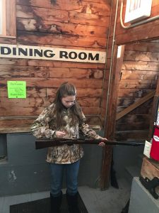 York County Shooters 4-H Club member with her rifle