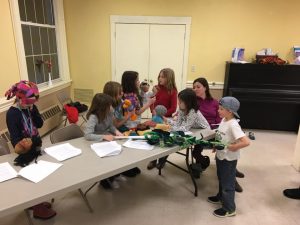 Nature Kids 4-H Club members working with puppets