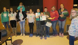 Lucky Charms 4-H Club members pose with ribbons