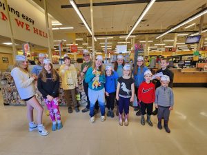Group photo of Nature Kids 4-H Club at Hannaford Supermarkets at the front of the store